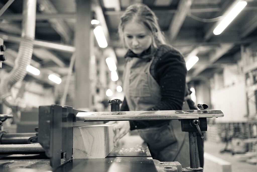 Ashton & Coleman furniture maker working in a woodworking workshop