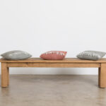 A solid wooden bench by Ashton & Coleman