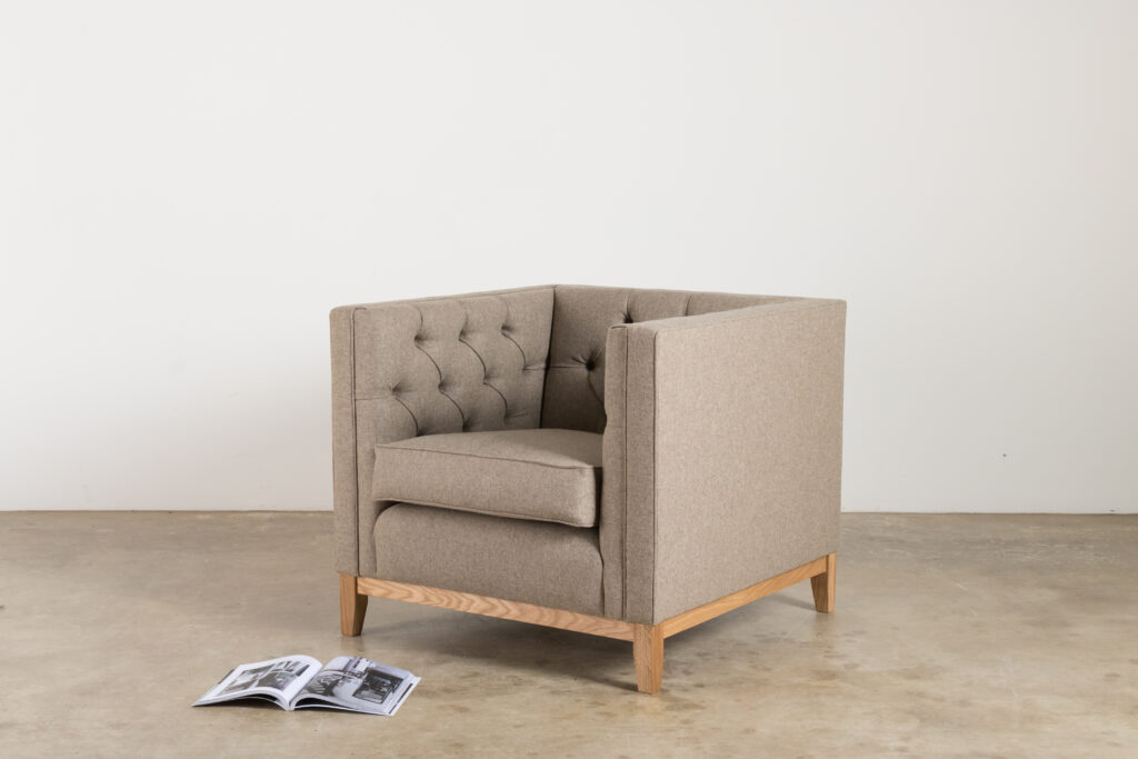 A grey wool armchair