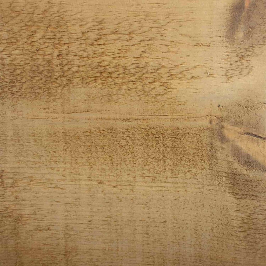 A close up of a piece of wood showing the Antique finish from the Ashton & Coleman Mill Sawn Pine furniture range