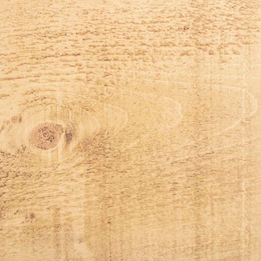 A close up of a piece of wood showing the Light finish from the Ashton & Coleman Mill Sawn Pine furniture range