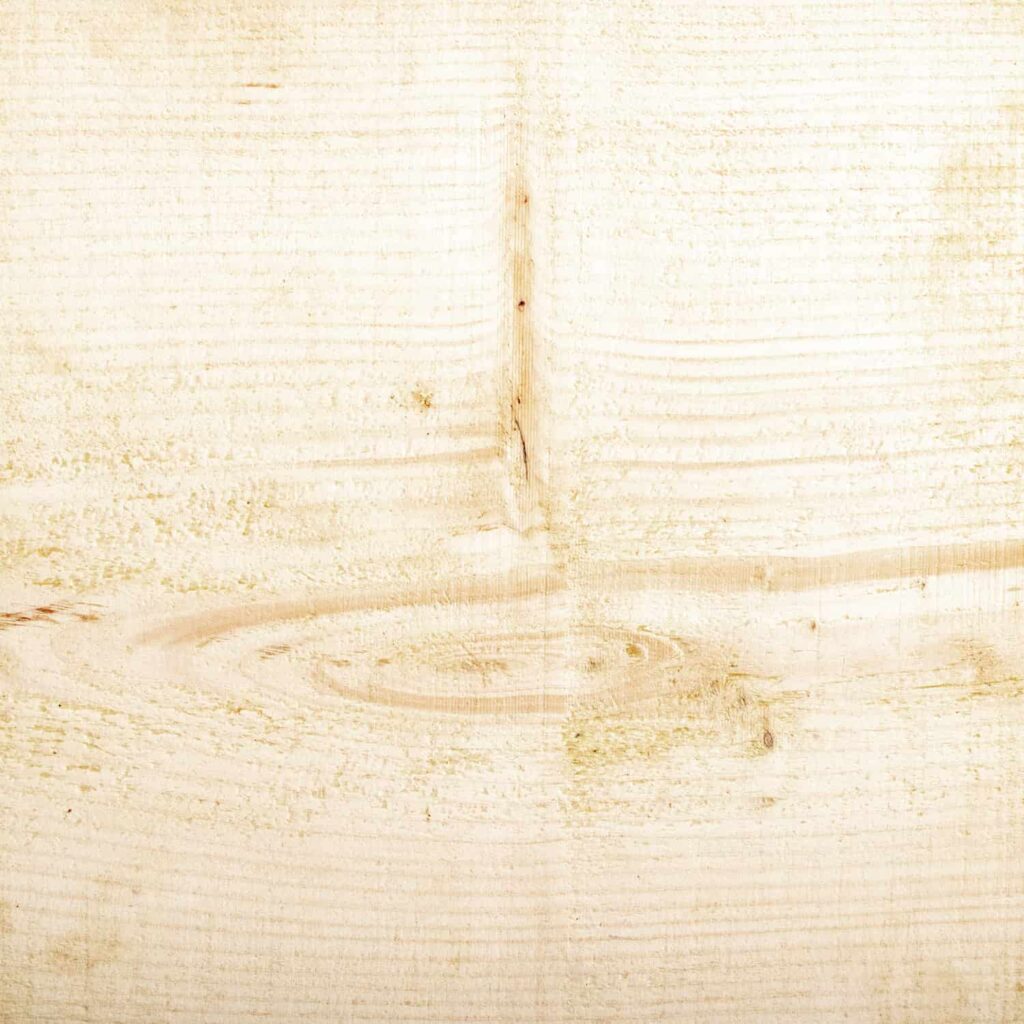 A close up of a piece of wood showing the natural finish from the Ashton & Coleman Mill Sawn Pine furniture range