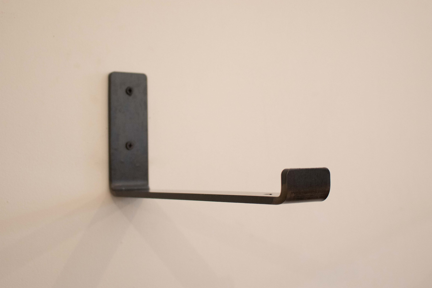 A modern rustic metal shelf bracket